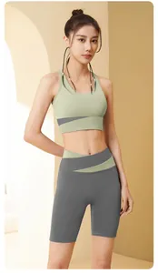 Professional seamless color-block yoga set featuring a sports bra and high-waist shorts