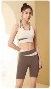 Slimming color-block yoga set featuring high-waisted fitness shorts and sports bra
