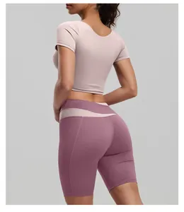 Slim fit mauve yoga shorts and pink crop top athletic set for women back view detail