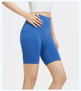 Detail shot of blue high-waist yoga shorts showing the ribbed side pocket texture