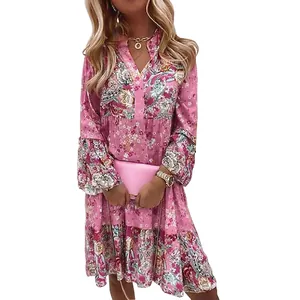 Bohemian pink floral long sleeve V-neck dress for women, casual tiered skirt detail.
