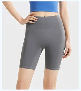 Close-up of grey high-waisted yoga shorts with side pockets and ribbed detail