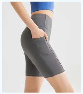 Close-up of high-waisted yoga shorts showing the ribbed texture side pocket detail