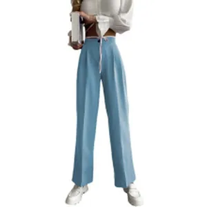 Light blue high-waisted wide-leg trousers on model for a casual, elegant style.