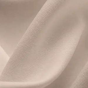 Gros plan sur un tissu côtelé en polyester-élasthanne extensible pour legging jupe de yoga