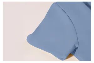 Close-up detail of double stitching on a blue short sleeve yoga sports top.