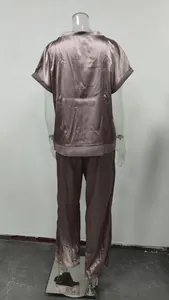 Back view of elegant satin two-piece lounge set with short sleeve shirt and wide pants
