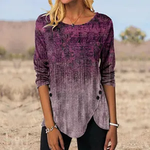 Close-up of women's long-sleeve gradient top with asymmetrical hem and button detail
