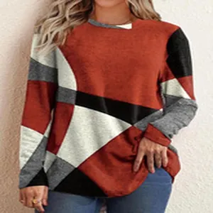 Detailed view of women's long-sleeve tee featuring a modern geometric color-block design