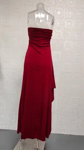 Back view of a red strapless maxi dress with ruched details on a mannequin