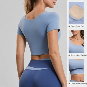 Short-sleeved color-block yoga top with built-in pads and matching leggings set
