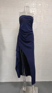 Close-up detail of sexy navy blue ruched strapless maxi dress with high side slit