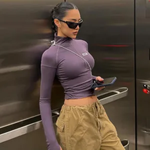 Urban style slim fit purple long sleeve top with high neck and small chest patch detail