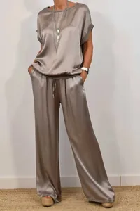 Elegant women's loose satin two-piece set with short-sleeved top and wide-leg pants