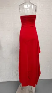 Detailed back view of an elegant red strapless maxi dress featuring side ruffles and a high slit