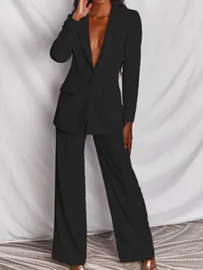 Stijlvol en elegant 2-delig zwart zakelijk damespak met blazer en trendy wijde broek