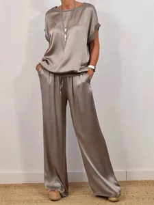 Elegant metallic satin two-piece set featuring a loose top and flowing wide-leg trousers