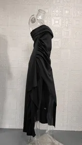 Detailed side view of elegant black strapless ruched maxi dress with high slit