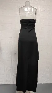 Back view of black strapless tube maxi dress with ruffle detailing on mannequin