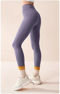 Detail shot of purple high-waisted seamless yoga leggings with thermal fleece lining