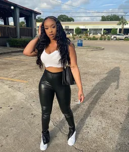 Stylish black high-waist faux leather split hem trousers for women casual street style