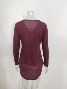 Back view of a long-sleeve burgundy V-neck lace-up tunic top on a mannequin.