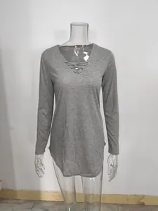 Detailed view of the V-neck lace-up design on a soft gray long-sleeved women's T-shirt.
