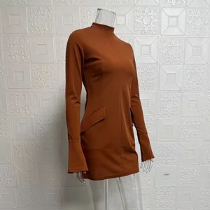 Close-up detail of rust brown long-sleeve bodycon mini dress with elegant mock neck line