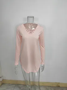 Full front view of a pink long sleeve top with V-neck lace-up detail on a mannequin
