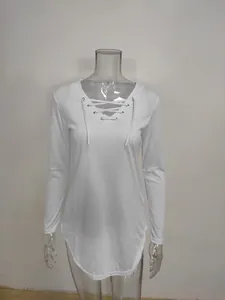 Detail view of a white long-sleeved T-shirt featuring a trendy lace-up V-neckline design.
