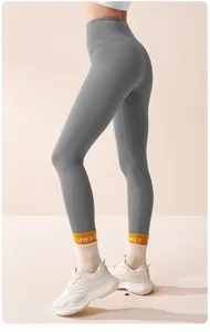 Detailed side view of high-waisted gray thermal leggings for fitness and yoga activities