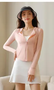 Detailed view of women's pink ice-feel sun protection jacket and white pleated sports skirt