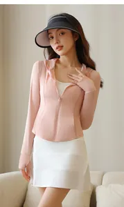 Asian model wearing a pink zip-up sun protection jacket and white pleated sports skirt