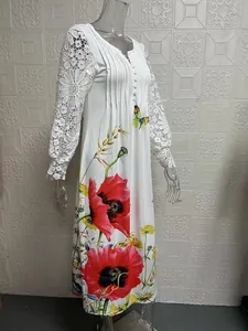 Detail of white floral maxi dress with elegant lace long sleeves and button neck
