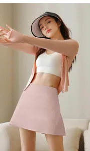 Detail showing a pink high-waisted pleated tennis skirt for women's athletic summer wear