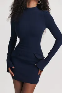 Detailed view of navy blue long-sleeved bodycon dress featuring elegant mock neck and pocket detail