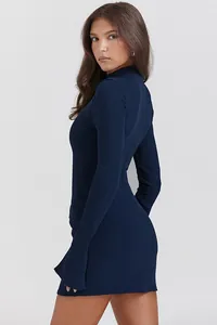 Side view of an elegant navy blue long-sleeved bodycon mini dress on a model.