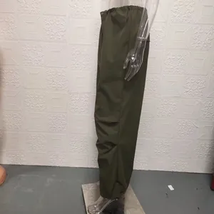 Detailed side view of army green wide-leg cargo trousers featuring drawstring cuffs