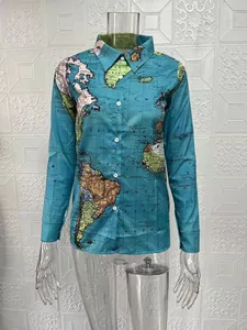 Detailed view of women's long-sleeve shirt with vintage world map print on blue fabric