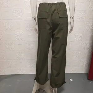 Detailed back view of olive green wide-leg cargo pants with elastic waist and flap pockets