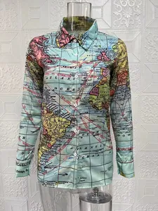Close-up detail of the vintage world map pattern on this women's long sleeve shirt