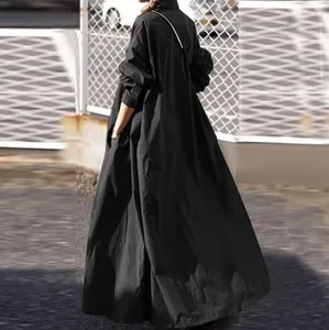 Back view of a long-sleeved black maxi dress with a loose retro fit and cotton linen feel