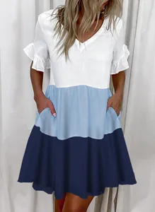 Detail view of the tricolor blue and white A-line dress with side pockets and V-neck.