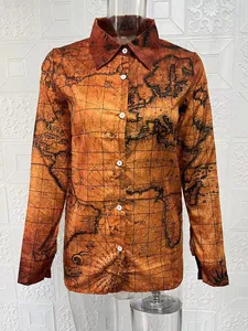 Detailed view of women's long-sleeve button-down shirt featuring a unique vintage map print