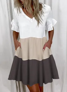 Close-up of a women's V-neck color-block summer dress with tiered ruffles and side pockets