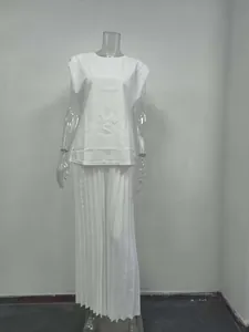 White two-piece fashion set featuring sleeveless round-neck top and pleated trousers