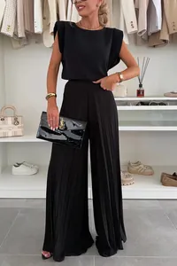 Detailed view of women's black two-piece set with sleeveless top and pleated wide-leg pants