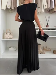 Elegant black two-piece set with sleeveless top and pleated wide-leg pants for women