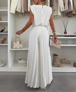 Back view of elegant white sleeveless top and pleated wide-leg trousers fashion set