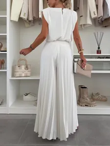 Elegant white sleeveless top and pleated wide-leg trousers two-piece fashion set.